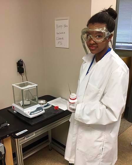 Alex measuring chemicals