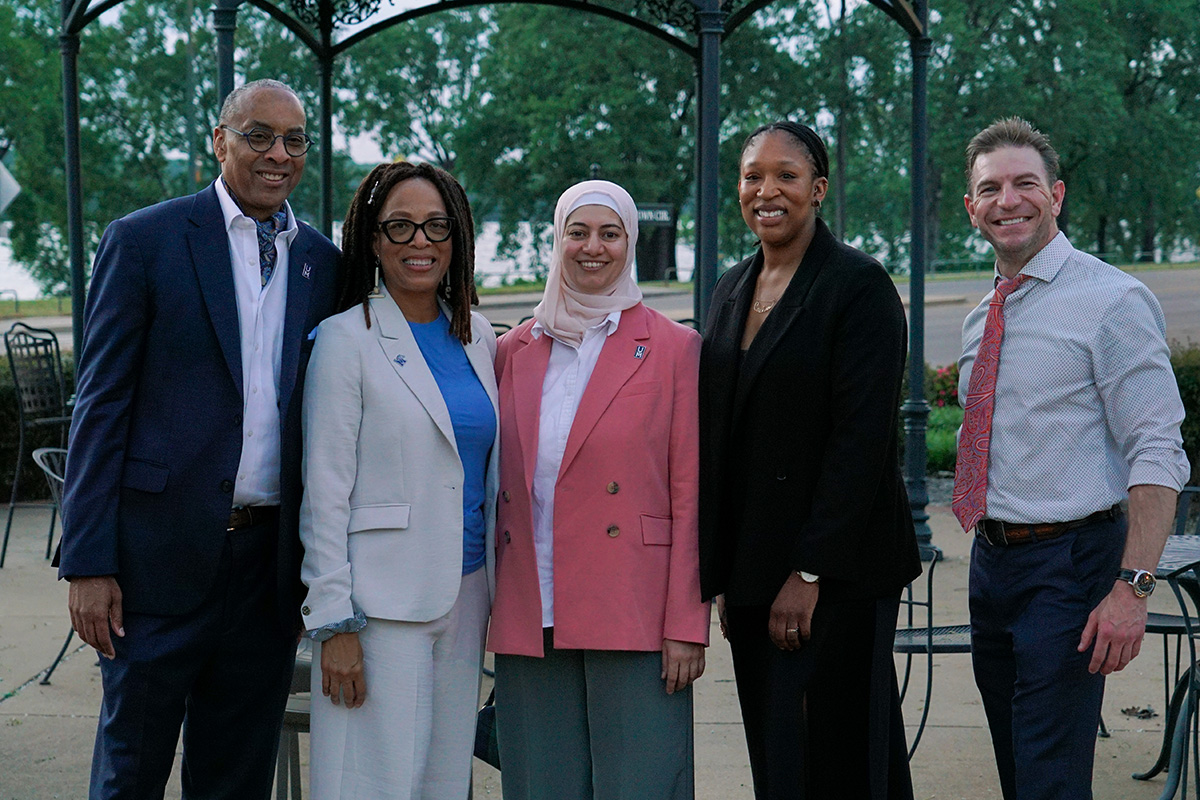 HSMP faculty stand outside the River Inn of Harbor Town 