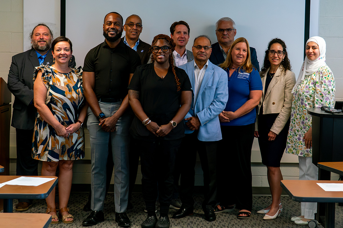(Center Back) Dean of the Fogelman College of Business and Economics, Dr. Robert Garret (Center Front) SPH Dean and Distinguished Professor, Dr. Ashish Joshi, accompanied by SPH and Fogelman faculty and staff