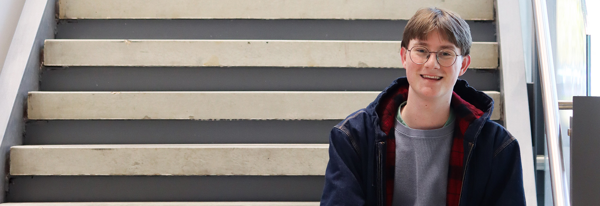 A male student on stairs