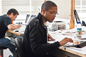 artists working at desk