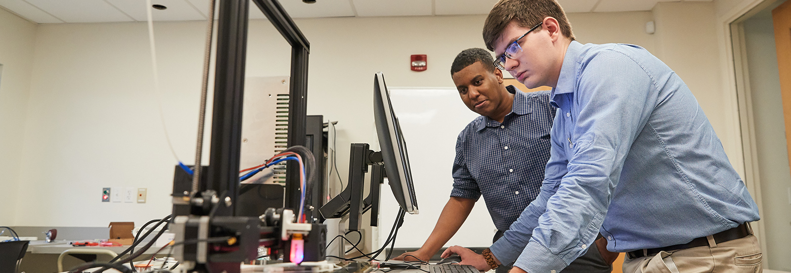 two students utilizing the technology resources at Crews Center of Entrepreneurship