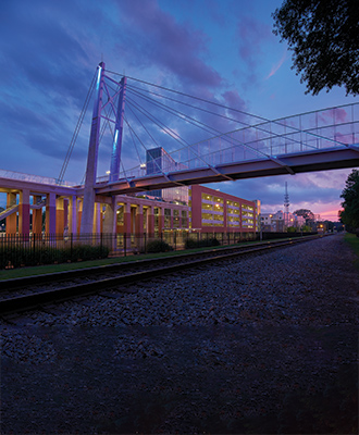 UofM Highlights (photo of pedestrian cable bridge)