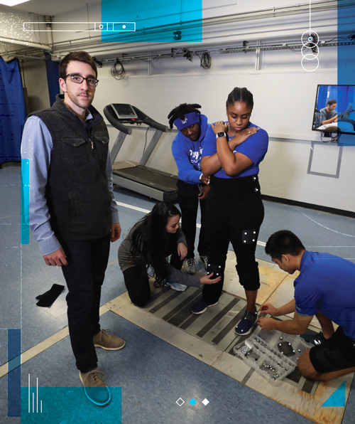 Paquette with students in lab