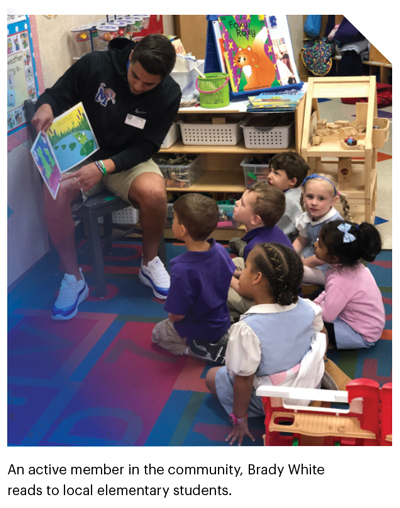 An active member in the community, Brady White reads to local elementary students.