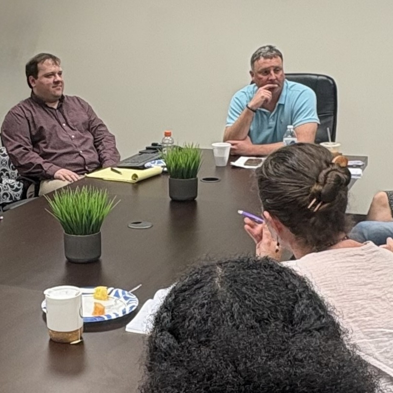 upskill workers around conference table