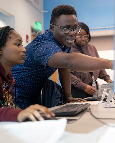 Dr. Tara Jones, (left); President Bill Hardgrave, Dean Bobby Garrett